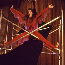 Thumbnail of dancer with legs and arms stretched out