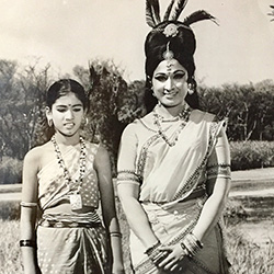 Thumbnail photo of Girl and woman with feather headress 