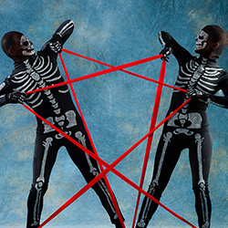 Thumbnail photo of Two dancers in skeleton costumes making the Star of David with red cords