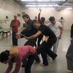 Thumbnail of Six dancers dancing together with an instructor guiding them