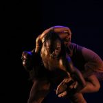 Thumbnail of One dancer lifting another dancer on their back