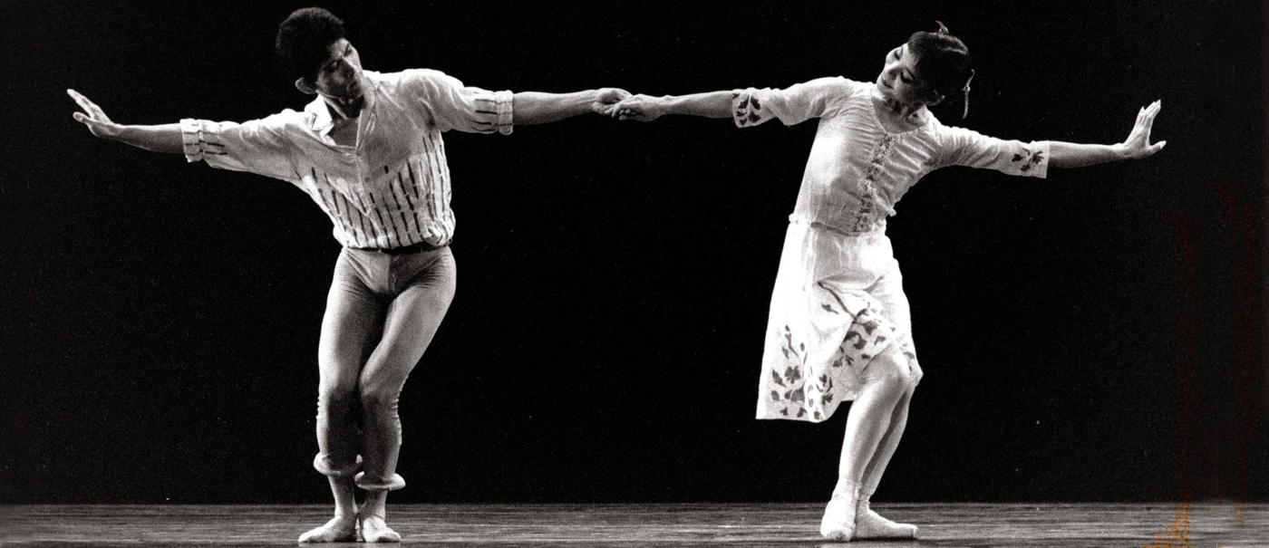 Two dancers holding hands