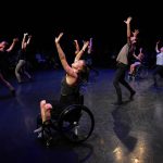 Thumbnail of group of dancers on stage two in wheelchairs