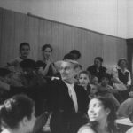 Thumbnail of Woman and students seated