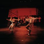 Thumbnail of two dancers lit in red
