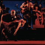 Thumbnail of woman leaning back man holding her