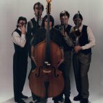 Thumbnail of group of people posing some with instruments