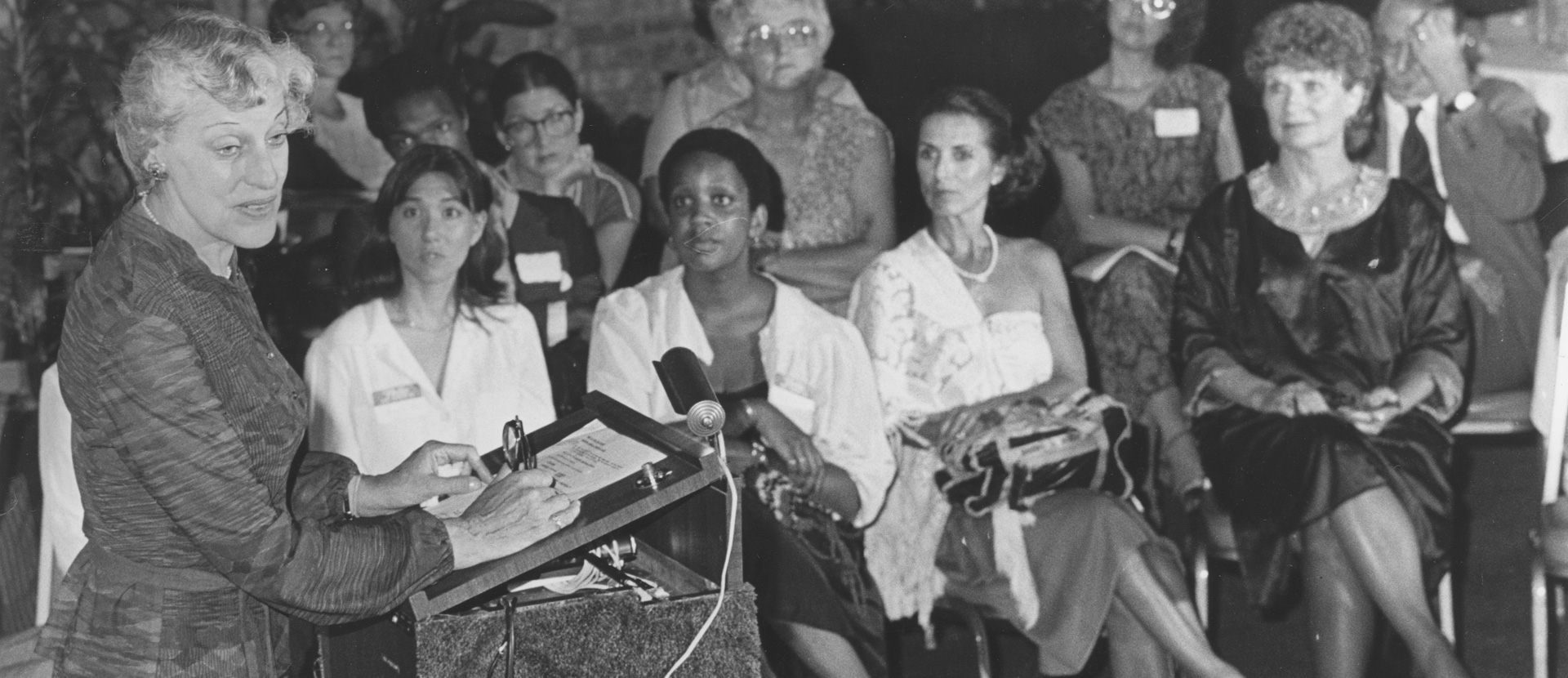 group seated speaker standing