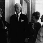 Thumbnail of Four people talking and smiling