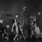 Thumbnail of Six dancers on stage holding sticks