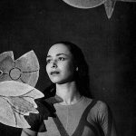 Thumbnail of Headshot of woman with flower props