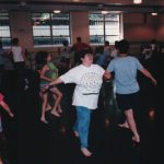 Thumbnail of two women in foreground dancing smiling