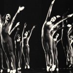 Thumbnail of group of dancers on stage Arms reaching up and right