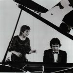 Thumbnail of woman singing behind pianist