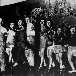 Thumbnail of group of dancers in a like left arms extended